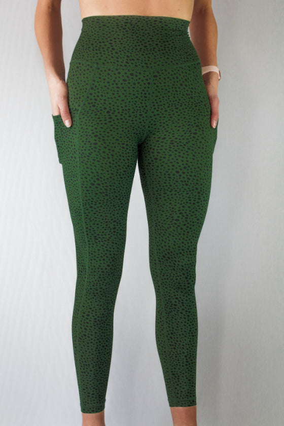 Front of green dapple leggings by Mama Life London