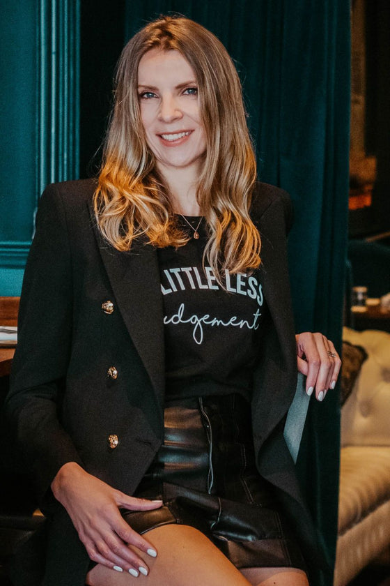 A little less judgement t-shirt styled with blazer by Mama Life London