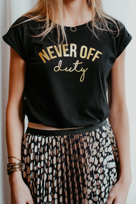 Never Off Duty t-shirt in black and gold styled with skirt
