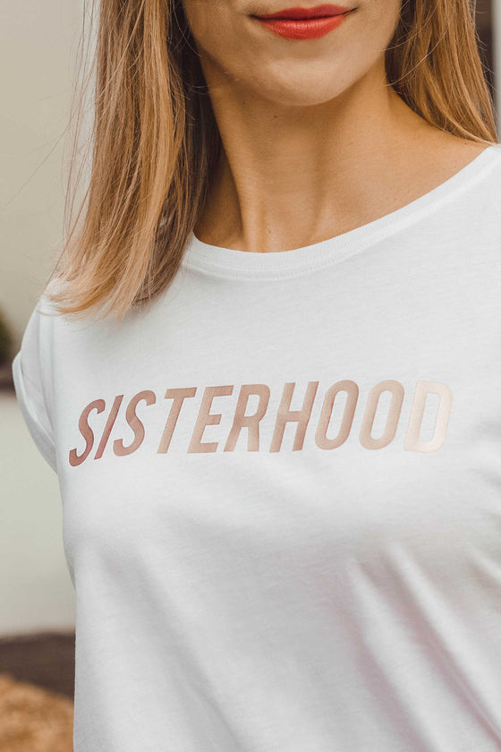 Sisterhood t-shirt close up of rose gold slogan
